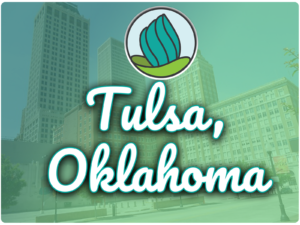 This image shows tall buildings in the background. In the top center, there is the logo of NDC and below there is the text " Tulsa Oklahoma "