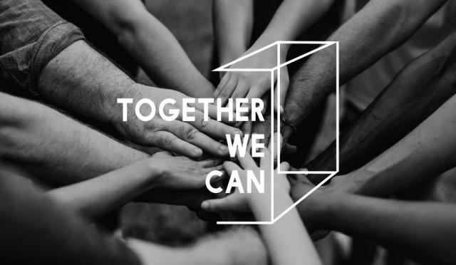 This is a black and white image of sitting in a circle and holding hands together. There is a partial 3D cube image with the text " TOGETHER WE CAN" on it.