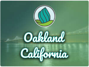 This image shows the San Francisco-Oakland Bay Bridge in the background. In the top center, there is the logo of NDC and below there is the text " Oakland California"