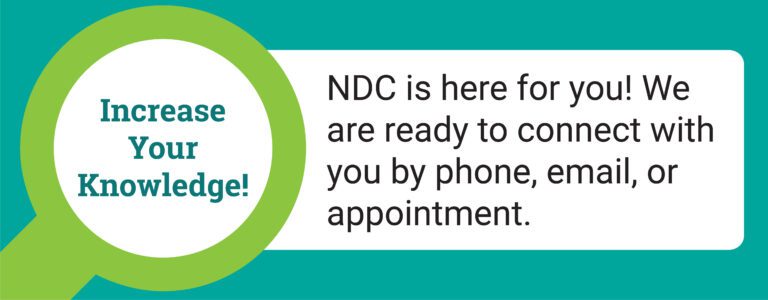 Rectangular image with green background and a magnify glass on the left with the message, "NDC is here for you! We are ready to connect with you by phone, email, or appointment"