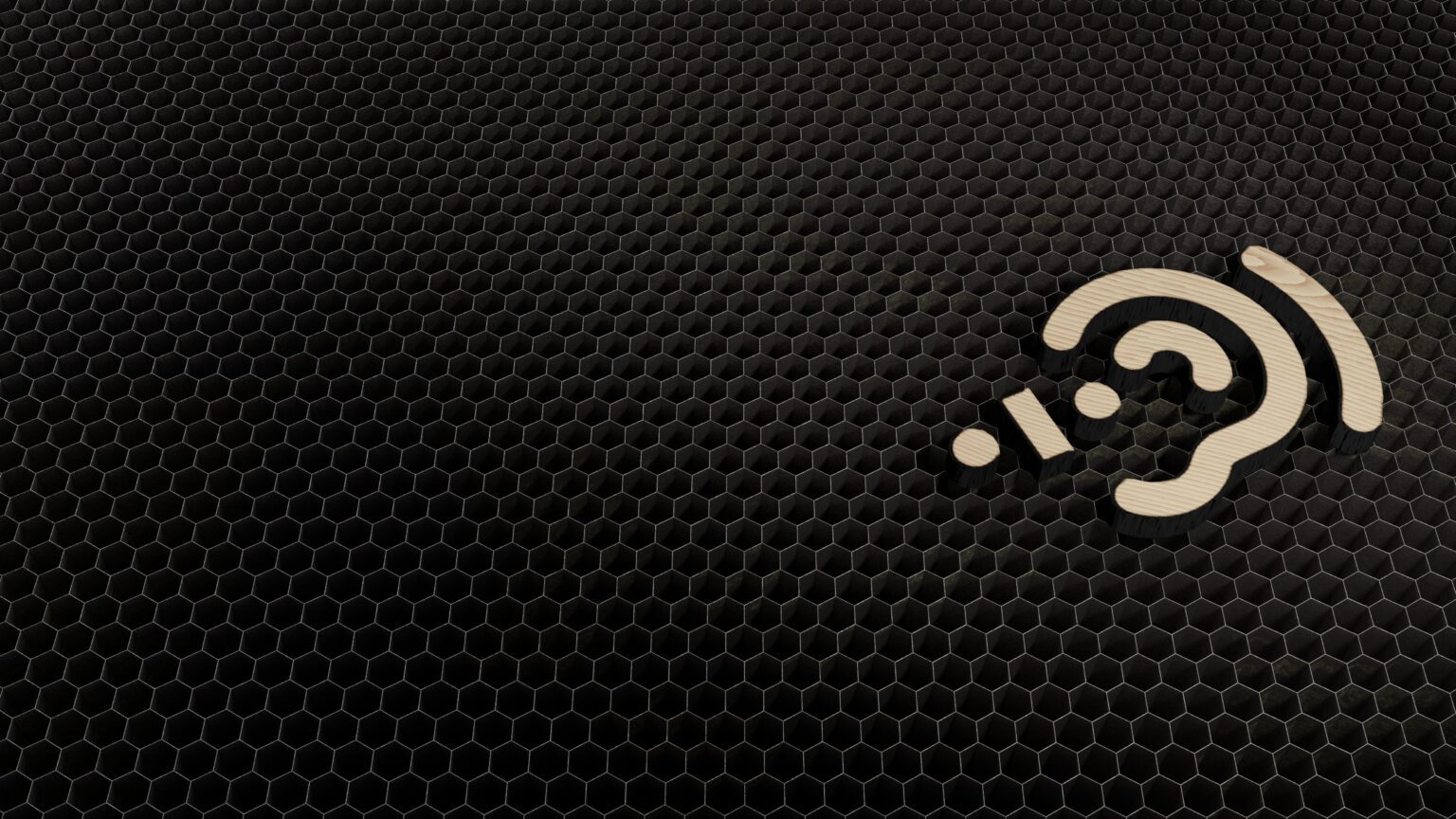 Black honeycomb as background with a image showing the symbol of assistive listening system.