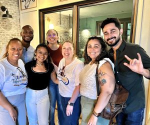 Tia Ivanko, Kenton Meyers, Zoé Marie Rodríguez, Mariana Otona, Kate Lewandowski, Marina Martinez Cora, and Jose De Jesus smiling in a group photo.